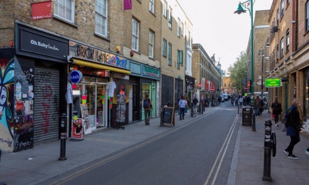 Alan Miller’s launch of the Vibe bar 20 years ago helped turn Brick Lane, pictured, into a creative and cultural centre in east London. Photograph: Graham Turner